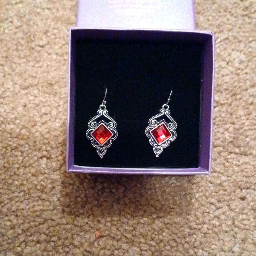 NWT Silvertone earrings with red stone